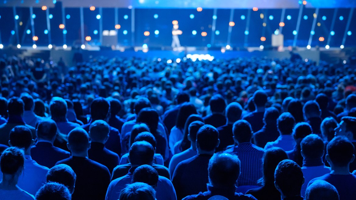 audience-listening-to-speaker-in-conference-hall